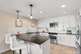 Counter seating adds to the functionality of the kitchen.