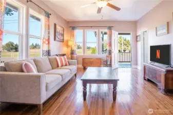 Living room space and great overhead fan. New hardwood flooring.
