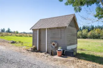 Near the front of the property and the home is this little outbuilding.