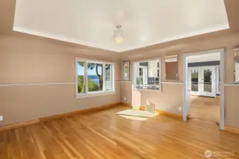 Formal dining with coved ceilings and pass through to the oversized chef's kitchen
