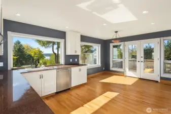 The oversized kitchen offers casual dining and opens to the patio for al fresco dining