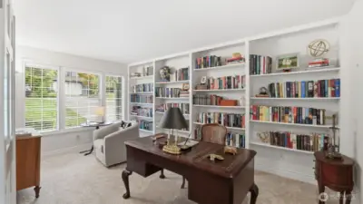 Most rooms in this home have an abundance of natural light pouring into the home.  The den is extra-large with a set of built-in bookcases a closet and tremendous finish work.  With a contractor's help the den and the half bath can be combined making it a perfect main floor bedroom with a 3/4 bath.