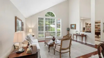 A second view of the living room and the area near the entry.