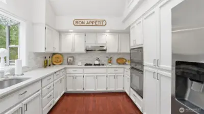 The kitchen has been well designed for storage counter space and plenty of helpers.