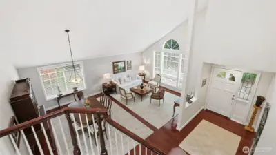 As you begin to descend to the main level of the home your view is this wonderful view of the light, the beautiful stair case, the vaulted ceilings and the incredible design of the home.