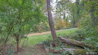 Just outside of the home's fenced area the path is easily accessible.  This path leads to a set of tennis courts and basketball court.