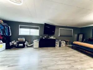 Primary bedroom, LVP flooring, access to deck, attached bathroom