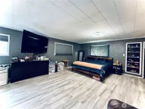 Primary bedroom, LVP flooring, access to deck