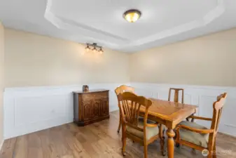 Dining room and/or game room as you enter into the home.  Plumbed wet bar stays.  This room was previously used for an in-home hair salon.