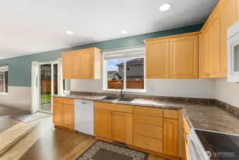 Sunny kitchen with views out to the backyard.