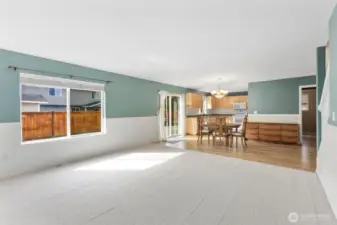 Living room open to dining area and kitchen.