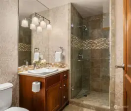 A third bathroom is located conveniently to the second bedroom.
