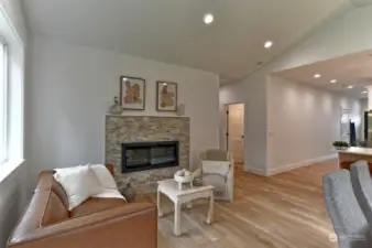 Great Room with fireplace and vaulted ceilings.