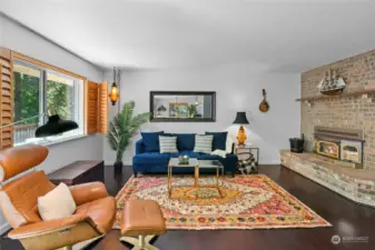 Living room with wood-burning fireplace.