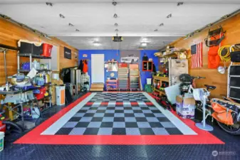 This garage is a mechanic's or craftsman's dream! The floor tiles will remain.