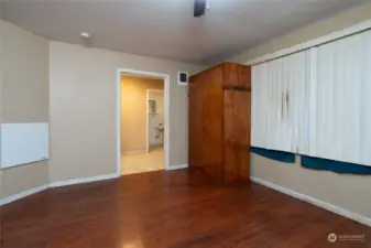 Office/Guest room in the South wing with 1/2 bath across the hall - 3/4 bath down the hallway.