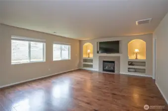Enjoy natural light and backyard views through two generous windows in the family room, facing the fenced and terraced yard.