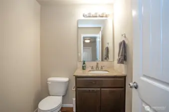 Easily accessible main floor half bath—ideal for guests and daily use.