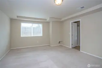 Another angle of the spacious primary suite with direct access to the private 5-piece bath.