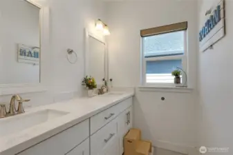 2nd full bathroom with double sink and separate bathtub.