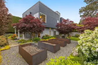 Custom built steel raised flower beds that offer endless possibilities for flower and vegetable gardens.