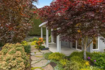 Exquisite landscaping in front and back and wide designer style paver walkways in front and back.