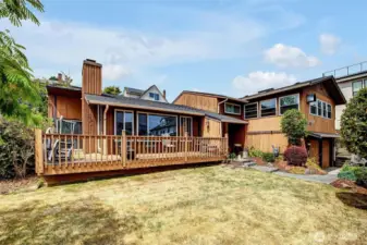 This floor plan and generous grounds are perfect for entertaining large groups! 2 expansive decks, one on main level, one on upper level, and level- entry from kitchen to back yard and side yards-big guest lists are no problem.