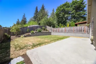 Poured concrete patio is easy maintenance on a level backyard