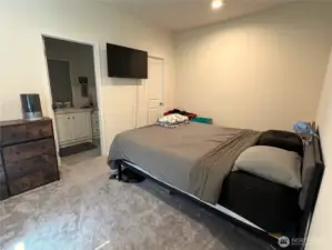 Primary bedroom with attached bathroom. On the opposite side of the home from the other bedrooms. Large deep closet.