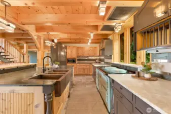 Copper kitchen sink, custom notty pine cabinets