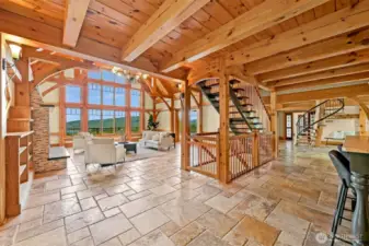 Copper railings & Cherry hardwood floors, lead up to loft and down to the lower level