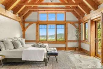 Primary bedroom located on the main level. View of Lake Whatcom, exposed vaulted beam ceiling.
