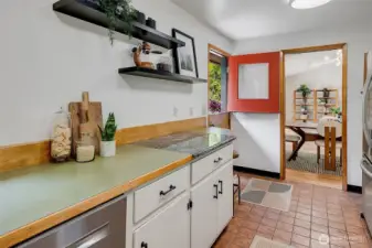 Sweet barn door opens from kitchen to back driveway/parking.