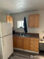 ADU/Extra building kitchen area with microwave and refrigerator. Approx 320 square feet of space