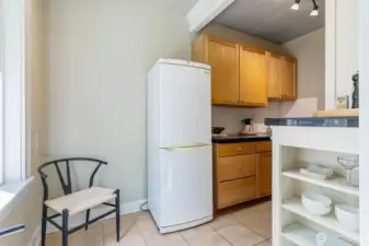Updated kitchen with historic 1920s character, freshly painted cabinets, and room for a breakfast table.