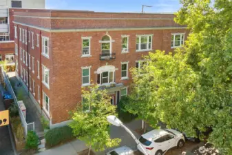Charming brick exterior with garden surroundings, just steps from UW, cafés, and Light Rail.