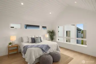 Up the stairs you will find your luxe primary suite. Enjoy the spacious feel from the gabled roofline & hardwood throughout the entire home.