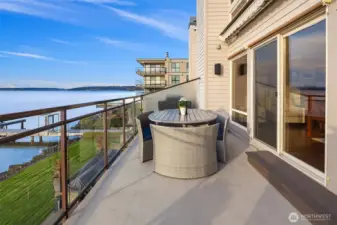 Expansive, private view deck featuring a sleek glass railing designed to showcase every uninterrupted vista