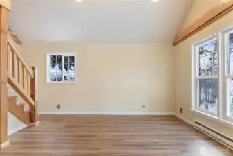 Light filled living room with custom wood work
