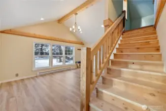 Custom built staircase to leads to primary suite