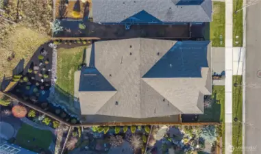 Nice, deep backyard backing to permanent greenspace.  Yard could easily be fully fenced by simply adding a fence along the rear property line which is along the dark mulch line to the West.