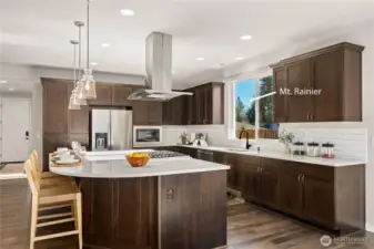 Gorgeous, light filled kitchen with a stellar view of Mt. Rainier! Clean lines and timeless style w/ Quarts counters, classic cabinets, subtle backsplash and custom pendant lighting.