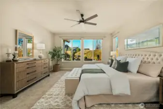 Primary bedroom overlooking the private backyard and permanent greenspace.