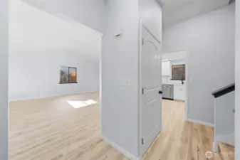 Welcome home, to the left is a spacious living room and forward to the kitchen.