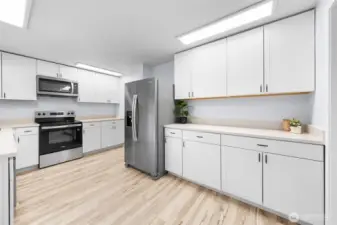 Completely updated kitchen with expanded counter space and new stainless steel appliances.