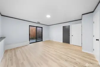 The grey door leads you into the garage and the white door allows you to create a whole separate room for additional privacy.  The slider leads to the backyard.