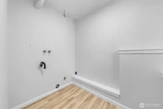 Laundry room in the day light basement.  We have working washer and dryer in the garage if you choose to keep them.