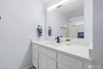 Hallway bath with new cabinets, granite counter tops, mirror and lights!