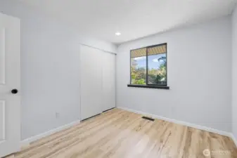 Looking at the home from the outside the window on the left above the garage.