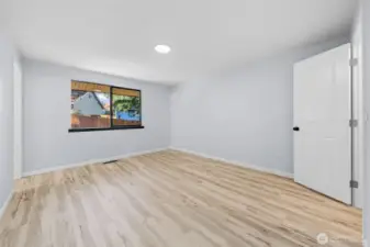 Walking into the primary suite.  There is a walk in closet to the right and to the left is the primary  3/4 bathroom.